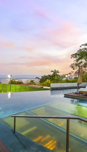 Sunset infinity pool with ocean view at a villa in Cruz de Huanacaxtle